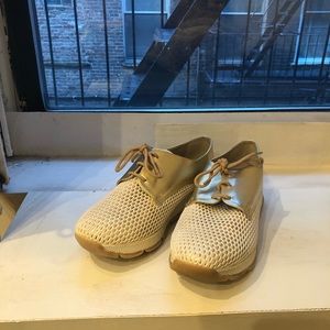 Gold platform sneakers